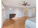 Spacious bedroom with hardwood floors, with ensuite renovated bathroom and views of the canal at 571 Birdie Ln, Longboat Key, FL 34228