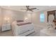 Cozy bedroom features neutral tones, plush bedding, and a decorative mirror at 571 Birdie Ln, Longboat Key, FL 34228