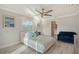 Bedroom featuring a large bed with throw pillows and an adjacent bathroom at 571 Birdie Ln, Longboat Key, FL 34228