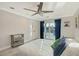Bedroom with blue curtains leading to backyard pool at 571 Birdie Ln, Longboat Key, FL 34228