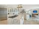 Spacious kitchen featuring marble countertops, modern appliances, and an open layout at 571 Birdie Ln, Longboat Key, FL 34228