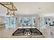 Gourmet kitchen boasts views of the canal, a gas range, and a cozy window seating area at 571 Birdie Ln, Longboat Key, FL 34228