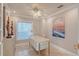 Charming home office with a decorative ceiling fan, modern desk, and elegant decor at 571 Birdie Ln, Longboat Key, FL 34228