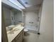 Neutral bathroom with patterned wallpaper, a shower and tub combo and tiled floors at 5803 Garden Lakes Palm, Bradenton, FL 34203