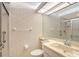 Full bathroom with shower and sink, featuring neutral wall paper, lighting and fixtures at 5803 Garden Lakes Palm, Bradenton, FL 34203
