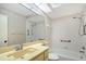 Full bathroom with shower and tub, featuring neutral wall paper, lighting and fixtures at 5803 Garden Lakes Palm, Bradenton, FL 34203