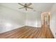 This bedroom offers a ceiling fan and view of the entrance to the home at 5803 Garden Lakes Palm, Bradenton, FL 34203