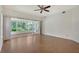 Large bedroom with hard wood floors, ceiling fan and views of backyard at 5803 Garden Lakes Palm, Bradenton, FL 34203