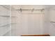 Walk-in closet with built-in wire shelving for optimal organization at 5803 Garden Lakes Palm, Bradenton, FL 34203