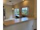Dining area with wood floors, overhead lighting, and bright windows at 5803 Garden Lakes Palm, Bradenton, FL 34203