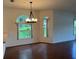 Open concept dining area featuring wood floors and natural lighting at 5803 Garden Lakes Palm, Bradenton, FL 34203
