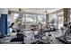 Well-equipped community gym with cardio machines, weights, and a view of the outdoors at 5803 Garden Lakes Palm, Bradenton, FL 34203