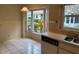 The eat-in kitchen features bright tile floors and a window filled view at 5803 Garden Lakes Palm, Bradenton, FL 34203