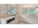 Functional kitchen with plenty of counter space and view to the living area and backyard at 5803 Garden Lakes Palm, Bradenton, FL 34203