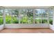 View from the lanai showcasing the beautiful lake and outdoor greenery at 5803 Garden Lakes Palm, Bradenton, FL 34203