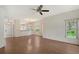 Open concept living room boasts wood floors and natural light at 5803 Garden Lakes Palm, Bradenton, FL 34203