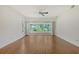 Bright living room featuring wood floors and sliding glass doors at 5803 Garden Lakes Palm, Bradenton, FL 34203