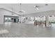 Spacious recreation room with tables, chairs, and a bar area, perfect for community gatherings at 5803 Garden Lakes Palm, Bradenton, FL 34203