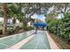 Community shuffleboard courts with a shaded seating area, perfect for friendly competition at 5803 Garden Lakes Palm, Bradenton, FL 34203