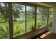 Bright sunroom with lovely views of the community pond, plants and landscaping at 5803 Garden Lakes Palm, Bradenton, FL 34203
