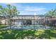 Expansive screened-in pool area with ample space for outdoor seating and entertainment at 6065 Marella Ct, Sarasota, FL 34243