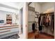 Bathroom with dual sinks and a view to a walk-in closet at 6065 Marella Ct, Sarasota, FL 34243