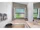Bathroom featuring a luxurious tub with natural light, and sleek fixtures at 6065 Marella Ct, Sarasota, FL 34243