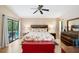 Spacious main bedroom with access to the pool area and ample closet space, ideal for relaxation at 6065 Marella Ct, Sarasota, FL 34243