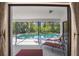 Relaxing outdoor patio with screened pool and lounge chairs perfect for enjoying the Florida sunshine at 6065 Marella Ct, Sarasota, FL 34243