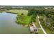 Aerial view of community lake with dock and path and recreation fields at 616 Dogwood Run, Bradenton, FL 34212