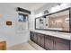 Well-lit bathroom featuring double sinks and large mirror at 616 Dogwood Run, Bradenton, FL 34212