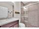 Bathroom featuring a tiled shower, a vanity with mirror, and neutral walls at 616 Dogwood Run, Bradenton, FL 34212