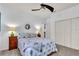 Bright bedroom featuring neutral walls, a coastal-themed decor, and a ceiling fan at 616 Dogwood Run, Bradenton, FL 34212