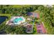 Aerial view of community amenities including pool, playground, tennis, and basketball courts at 616 Dogwood Run, Bradenton, FL 34212