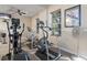 The community workout room provides machines for all types of exercise with TV and fans for comfort at 616 Dogwood Run, Bradenton, FL 34212