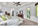 Carpeted main bedroom with outdoor access and ensuite bathroom at 616 Dogwood Run, Bradenton, FL 34212