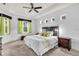 Spacious main bedroom with tray ceiling, carpet, and bright windows at 616 Dogwood Run, Bradenton, FL 34212