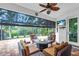 Enclosed patio featuring outdoor furniture, a ceiling fan, and an outdoor TV at 616 Dogwood Run, Bradenton, FL 34212