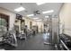 Well-equipped weight room with free weights, universal machines, TV, and fans for a complete fitness experience at 616 Dogwood Run, Bradenton, FL 34212