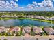 Beautiful home situated on a waterfront property with mature landscaping at 6318 Rivo Lakes Blvd, Sarasota, FL 34241