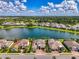 Waterfront home with stunning lake views and a lush green landscape at 6318 Rivo Lakes Blvd, Sarasota, FL 34241
