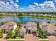 Beautiful lakefront home with a clay tile roof and stunning water views at 6318 Rivo Lakes Blvd, Sarasota, FL 34241