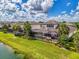 Enjoy the outdoor Florida lifestyle with this home's pool, screened lanai, and landscaped backyard at 6318 Rivo Lakes Blvd, Sarasota, FL 34241