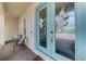 Elegant front entrance with double doors and an inviting seating area at 6318 Rivo Lakes Blvd, Sarasota, FL 34241