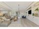 Spacious living room with built-ins, offering seamless flow to the kitchen at 6318 Rivo Lakes Blvd, Sarasota, FL 34241