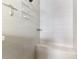 Modern shower features a built-in bench, sleek tile, and convenient storage shelving at 6318 Rivo Lakes Blvd, Sarasota, FL 34241
