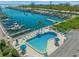 An aerial view of a community pool and boat dock at 655 Spanish Way, Longboat Key, FL 34228