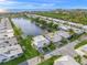 Overhead view of a waterfront community highlighting the peaceful lake and neighborhood layout at 655 Spanish Way, Longboat Key, FL 34228