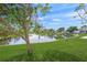 Lush green backyard view showcases water views and mature tree coverage at 655 Spanish Way, Longboat Key, FL 34228
