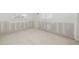 Bedroom in need of renovation with plaster walls and natural light streaming in from the windows at 655 Spanish Way, Longboat Key, FL 34228